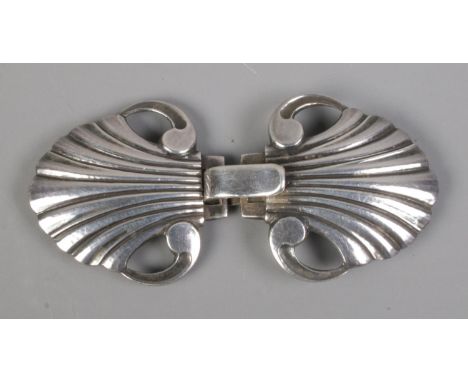 A small Georg Jensen sterling silver belt buckle, in the form of stylised shells. Stamped '44, sterling' to the back, with mo