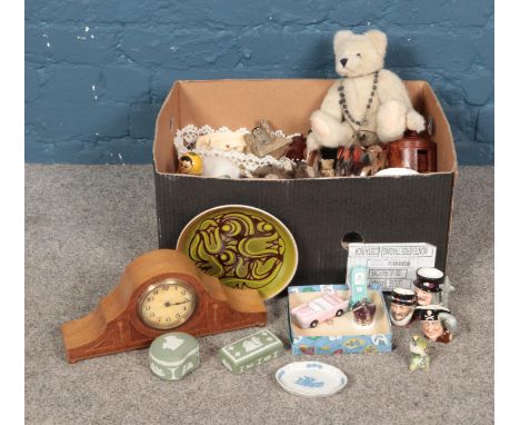 A box of assorted items, to include mantle clock, Poole plate, Wedgwood trinket dishes, ephemera and Beswick Goldcrest.  