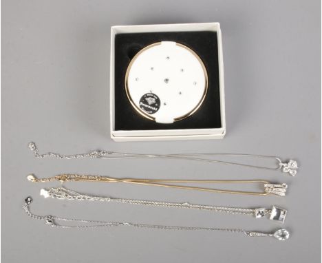 Three Swarovski crystal necklaces along with compact and Agatha necklace.  