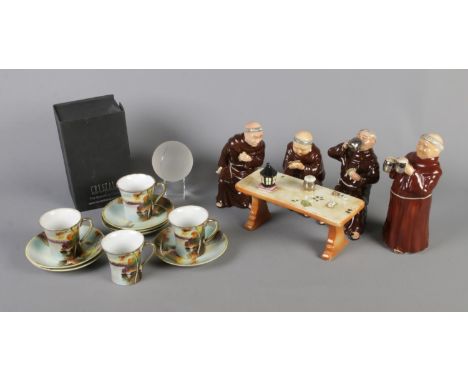 A ceramic Monk set around a tavern table, Nippon hand painted cups and saucers and boxed crystal tennis ball with stand.  