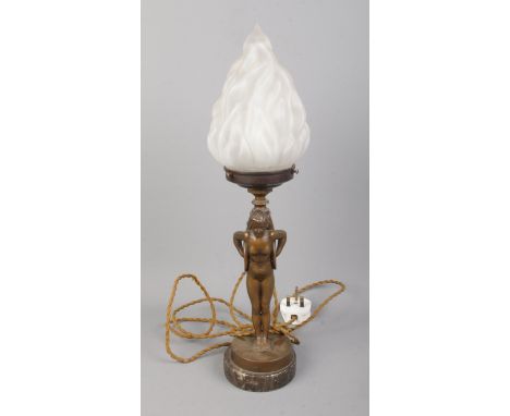An Art Deco style bronzed figural table lamp on marble base formed as a maiden carrying a torch.  Shade fitting has been repa