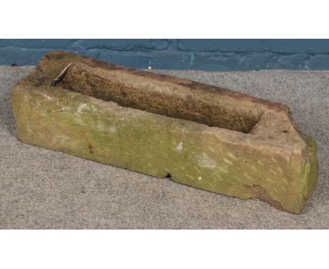 A stone trough. (72cm x 18cm)  