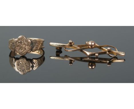 A 9ct floral engraved ring and pin brooch (broken pin). Ring size MÂ½, total weight 2.7g.  