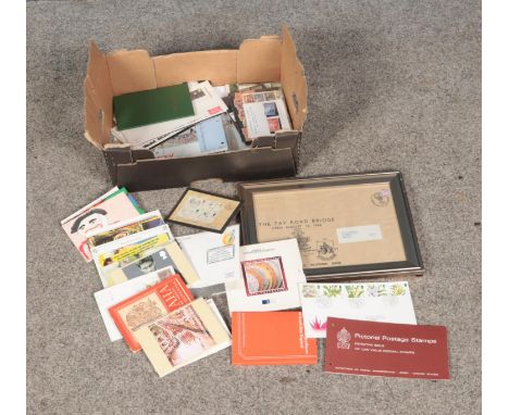 A collection of stamps, postcards and coins including 1991 Brilliant Uncirculated Coin Collection, presentation packs, first 