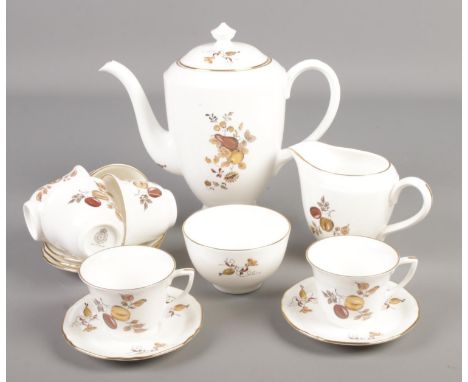 A Royal Worcester coffee set decorated in the Golden Harvest pattern.  
