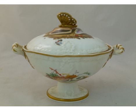 An H & R Daniel porcelain cream bowl and cover, Cusped shape, embossed, with butterfly finial and raised ribbon and wreath bo