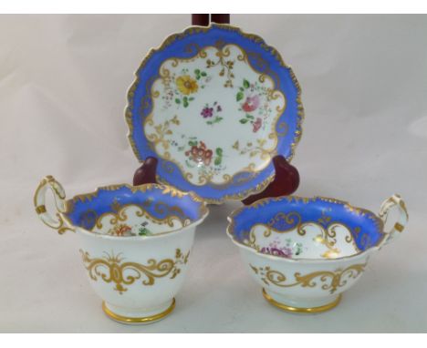 An H & R Daniel porcelain trio, Shrewsbury shape, each piece numbered 4896 in puce or gilt, with a blue border, gilt detail a