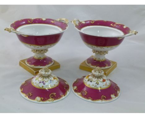 A pair of H & R Daniel porcelain cream bowls and covers, Shell Border shape, with vine and fruit finials and raised on square