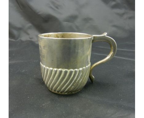 A late Victorian silver christening cup, with half gadrooned body and scroll handle, London 1894 by John Newton Mappin, with 
