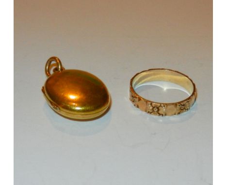 A small plain oval gold locket, 4.5g gross and an ornate yellow metal band 1.7g, ring size J 1/2 (2 items)