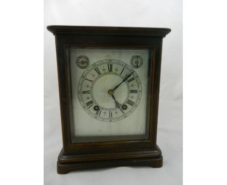 An early 20th century mantle clock with W&H movement striking on two gongs, with silvered chapter ring and subsidiary slow/fa