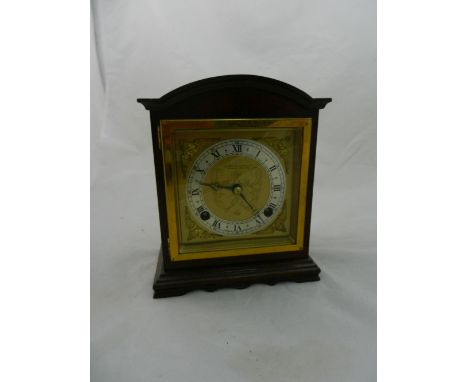 An Elliott mantel clock in mahogany case with brass and brushed steel dial, retailed by the Northern Goldsmiths Co., striking
