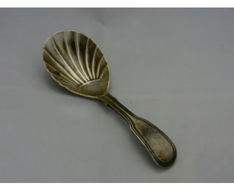 A Victorian silver fiddle and thread pattern caddy spoon with shell bowl, indistinct marks, 10.5cm long, 0.81ozt, 25g, 