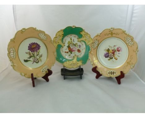 Three H & R Daniel porcelain plates, Shell Pierced shape, the first with apricot ground and decorated with a maroon aster, ti
