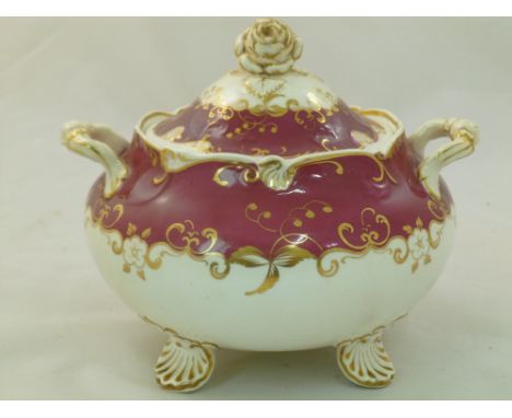 An H & R Daniel porcelain sugar bowl and cover, Shell shape, variation B, with shell feet and rose head finial, numbered 4768