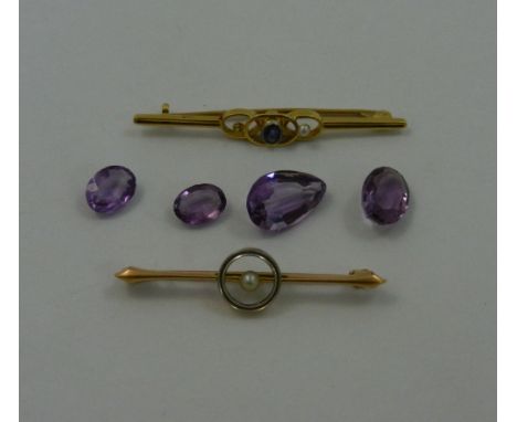 A 15 carat gold sapphire and seed pearl bar brooch, the central oval mixed cut sapphire in millegrain setting and open oval s