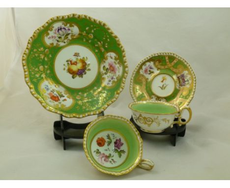An H & R Daniel porcelain saucer, First Gadroon shape, with green ground, gilt detail, apricot ground scrolls and panels deco