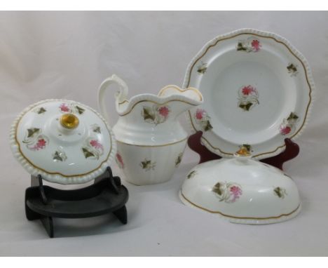 An H & R Daniel porcelain muffin dish and cover, First Gadroon shape with gilt finial and decorated with vine and fruit, the 
