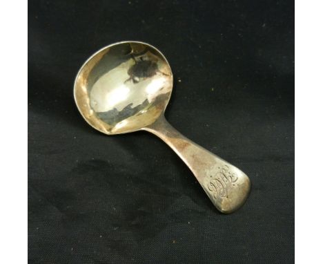 A George III silver caddy spoon, London 1808 maker's mark 'T.S' in an oval, engraved with scrolling initials, 7cm long