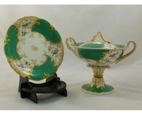 An H & R Daniel porcelain cream bowl and stand, Rococo Scroll shape, with green ground and gilt detail, decorated with birds 
