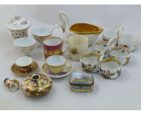 A collection of small porcelain items including Royal Crown Derby miniature items, an enamelled snuff box, a Sevres bisque po