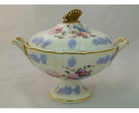 An H & R Daniel porcelain cream bowl and cover, Cusped shape, embossed, with butterfly finial and raised lilac vine and fruit