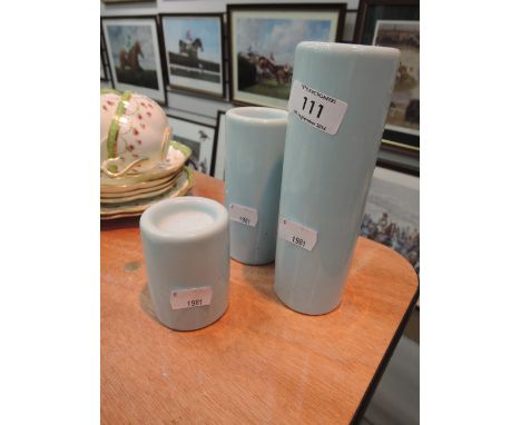 A set of three ceramic modern candle stands