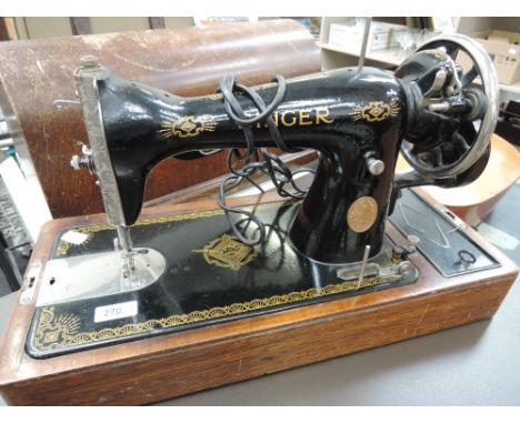 A vintage sewing machine and typewriter