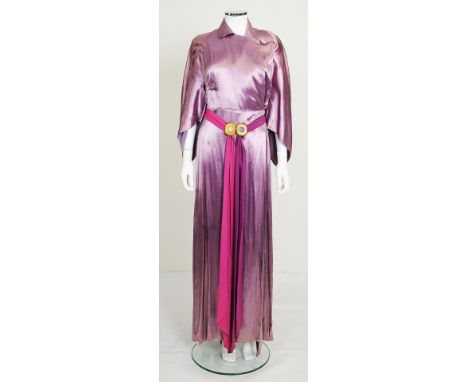 A long 1970s lilac satin dress, half length fluted sleeves, popper fastening to waist, large satin button fastening to neck, 