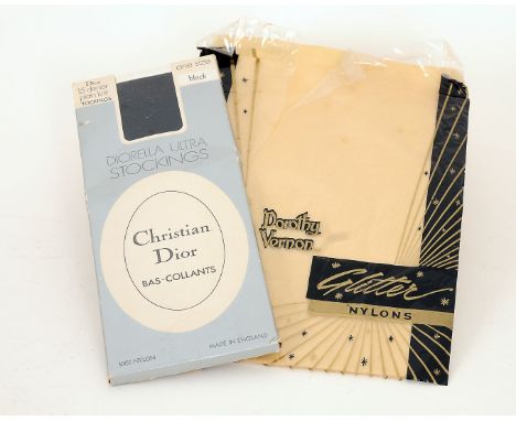 A pair of 1960s Christian Dior black stockings; together with a pair of 1960s Dorothy Vernon yellow 'glitter' tights (2)