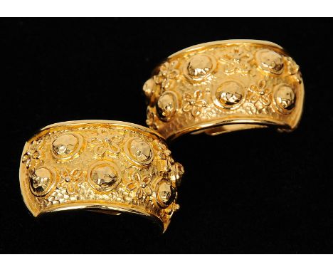 A pair of gilt metal clip on Christian Dior earrings, semi circle shape with embossed flower decoration, Dior stamped to back