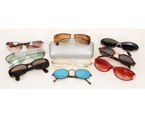 A collection of designer ladies sunglasses, including two pairs by Gucci, a pair of tortoiseshell coloured rimmed sunglasses 