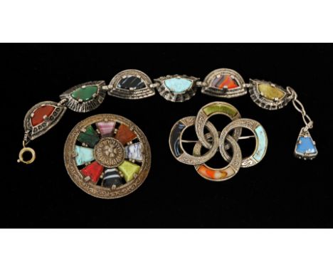 A silvered carved gilt metal and multicoloured faux stone set consisting of a bracelet and two brooches, bracelet measuring 1