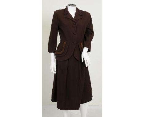 A 1940s burgundy coloured skirt and jacket two piece set, jacket with brown fur detailing to hips, button fastening to front,