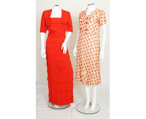 A 1940s long red crepe dress, square neck with bow detail, half length sleeves, matching belt to waist, zip fastening to side