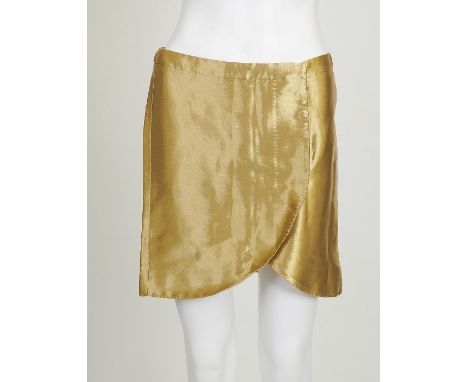 A 2008 Alexander McQueen gold mini skirt, curved hem, hidden button fastening to front, slits to back, Alexander McQueen and 
