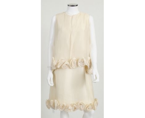 A white 1960s Christian Dior Boutique shift dress with matching sleeveless jacket, net overlay to dress with large material f