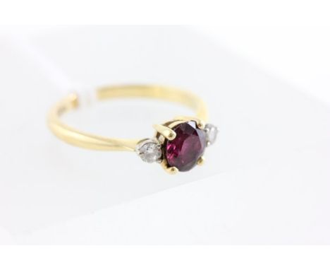 18ct Gold Ring set with ruby flanked by two diamonds