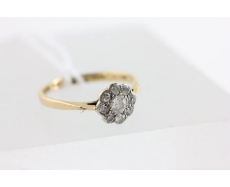 18ct Gold Ring set with in flower shaped cluster of diamonds