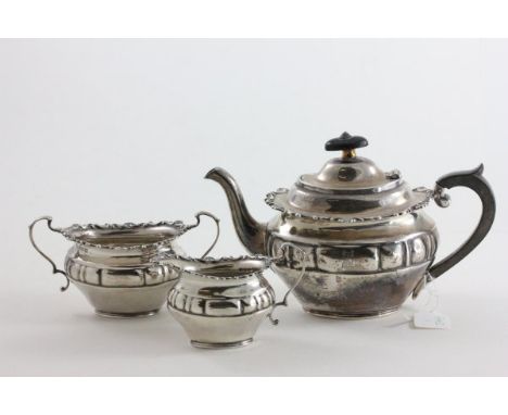 Small Silver Three Piece Tea Service, each piece with scroll edges and lobed sides, the teapot with ebony handle and finial, 