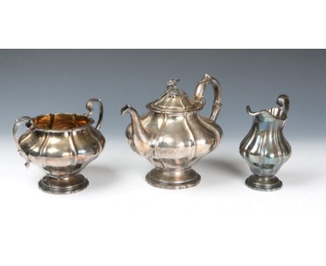 A VICTORIAN SILVER THREE PIECE TEA SET, gourd shaped teapot standing on a stepped base, matching domed lid with a rose finial