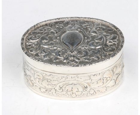 A GEORGE III OVAL SILVER TRINKET BOX with chased scroll and foliate decoration, 11.5cm long, London 1786, makers mark rubbed,