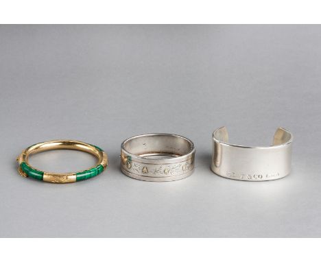 A VICTORIAN SILVER HINGED BANGLE with overlaid gold flowers, a malachite set hinged bangle and a torque stamped T & Co 925 (3