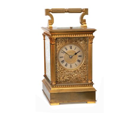 A 19TH CENTURY FRENCH BRASS CASED CARRIAGE CLOCK with silvered Roman chapter ring, the centre signed W Marshall & Co, Paris, 