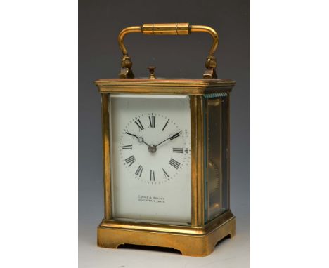 A FRENCH CARRIAGE CLOCK with white enamel Roman dial, signed Cooke & Kelvey, Calcutta and Paris, with platform lever escapeme