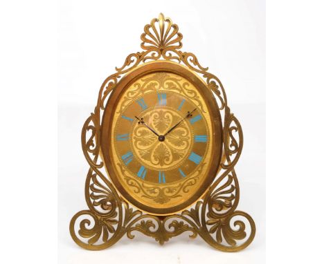 A VICTORIAN STRUTT CLOCK, the oval gilt dial with blue enamel Roman chapters, stylised honeysuckle engraved centre and pierce