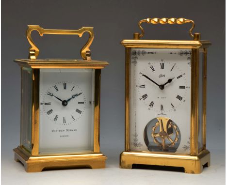 A MATTHEW NORMAN, LONDON CARRIAGE TIMEPIECE with white enamel Roman dial and heavy lacquered brass case, 11cm high and a Scha