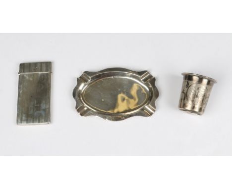 A SILVER CALLING CARD CASE with engine turned decoration, 8.5cm long, Birmingham 1910 by Deakin & Francis; an oval shaped sil