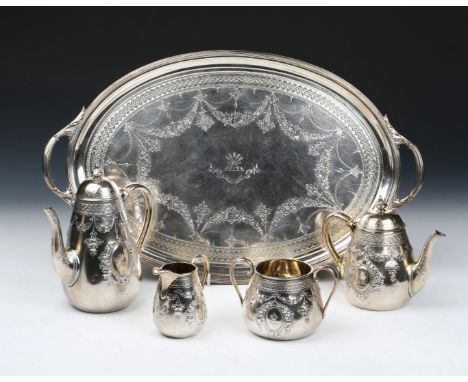 A VICTORIAN SILVER FOUR PIECE TEA SET consisting of a pear shaped teapot chased with garlands of flowers, matching hot water 