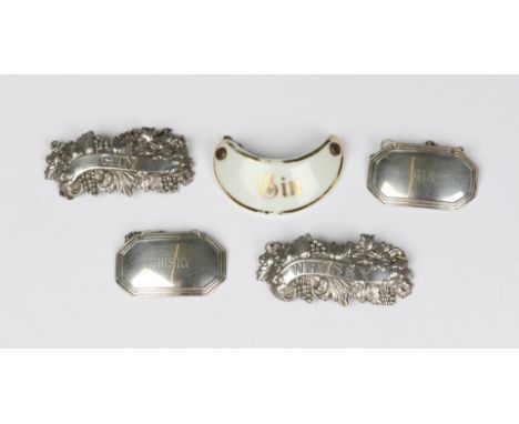 A PAIR OF SILVER DECANTER LABELS, octagonal shaped with reeded edges for Gin and Whisky, Birmingham 1947; two pressed silver 